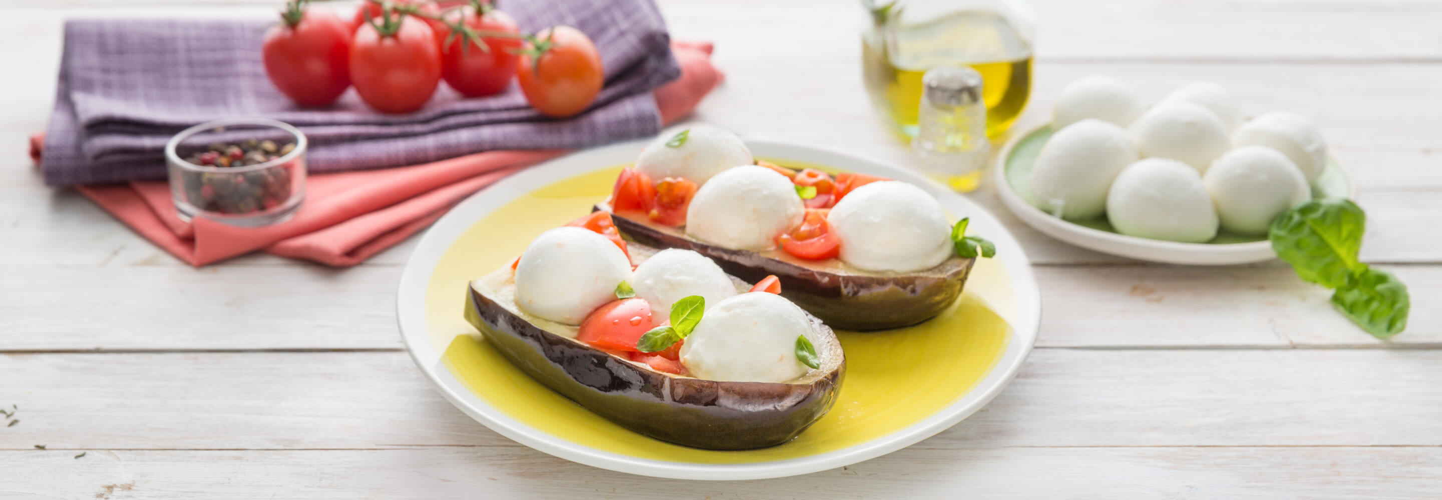 Melanzane ripiene con Mozzarella di latte di Bufala Mini e pomodorini